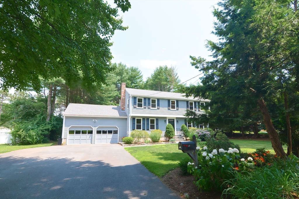 41 Eaton Road Framingham, MA 01701 - Photo 42 of 42 a front view of a house with garden