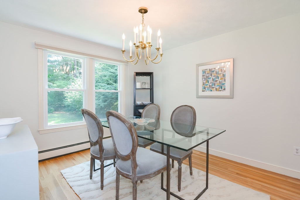 41 Eaton Road Framingham, MA 01701 - Photo 9 of 42 a dining room with chandelier and wooden floor