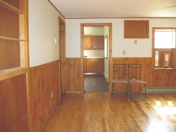 a view of a livingroom with furniture and wooden floor