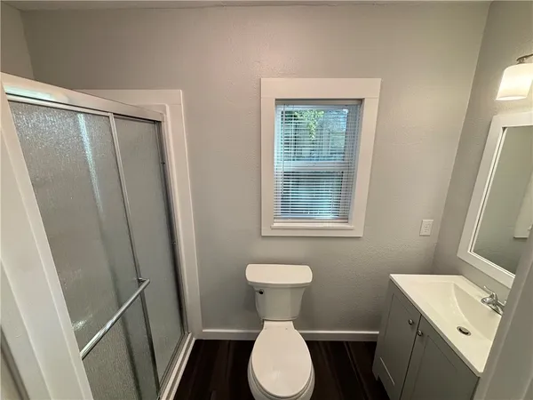 a bathroom with a sink toilet and a shower
