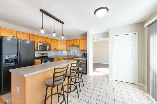 a view of a tennis ground with large trees