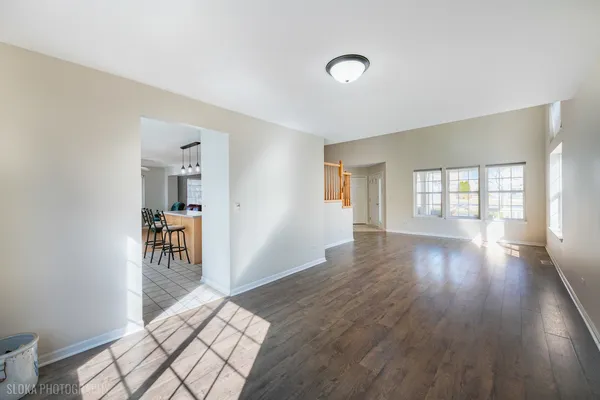 a front view of a house with a garden and yard