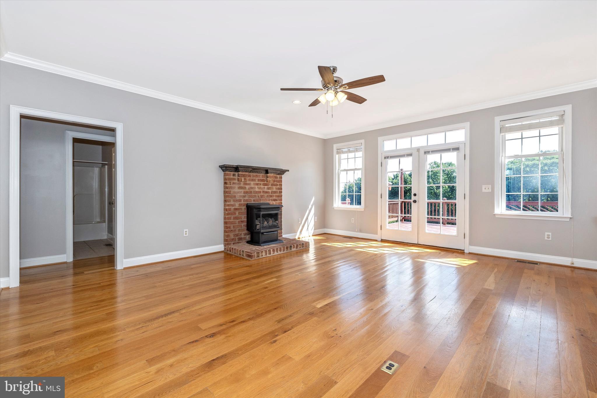 11129 Liberty Road Frederick, MD 21701 - Photo 12 of 44 Family room with gas fireplace and entry to deck