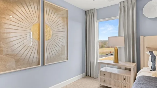 a spacious en suite bathroom with double sink and a mirror