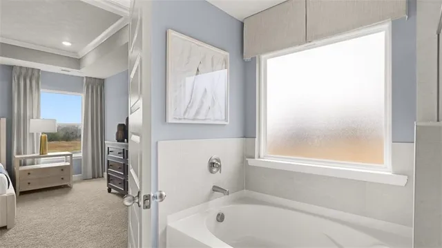 a view of a hallway with wooden floor and windows