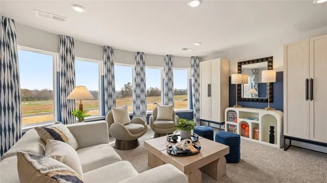 a view of a patio with furniture and a lake view