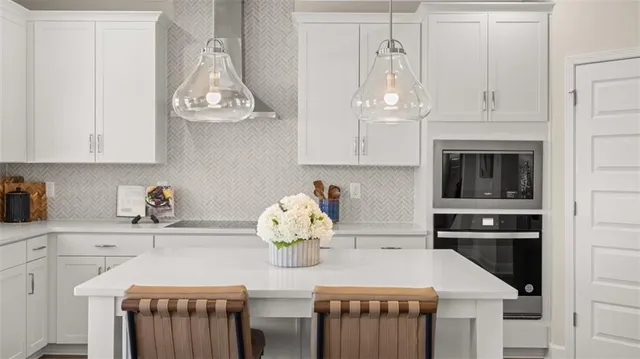 a living room with furniture a large window and a fireplace