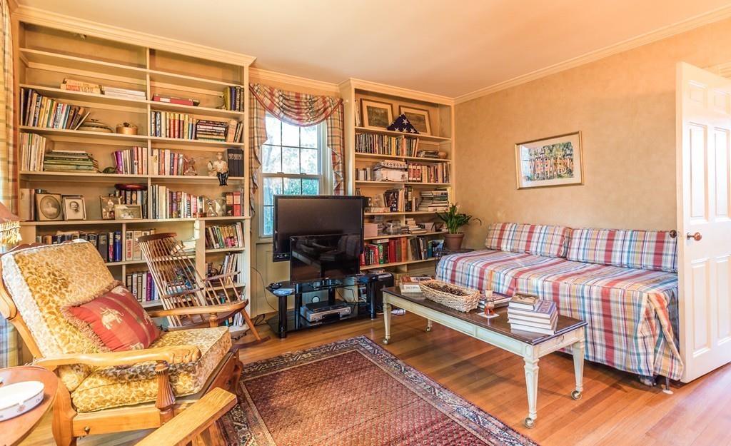 66 Burgess Avenue Rochester, MA 02770 - Photo 19 of 20 a living room with furniture a bookshelf and a window