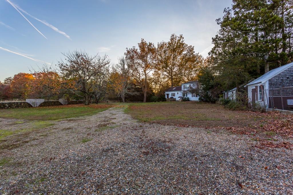 66 Burgess Avenue Rochester, MA 02770 - Photo 20 of 20 a view of a house with backyard and trees