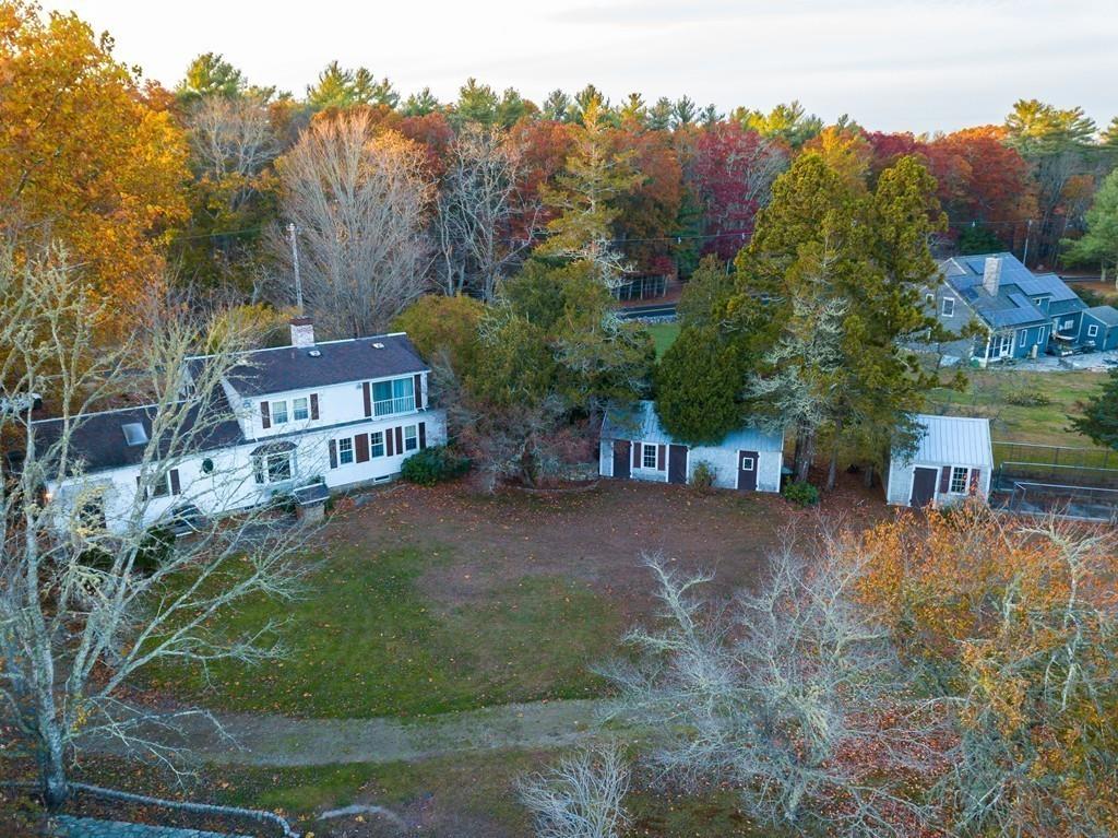 66 Burgess Avenue Rochester, MA 02770 - Photo 5 of 20 an aerial view of a house with a yard and large trees