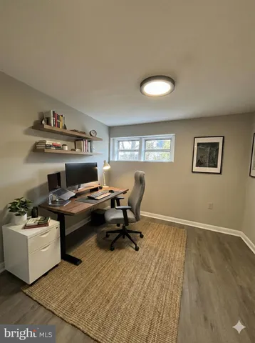 a workspace with furniture and window