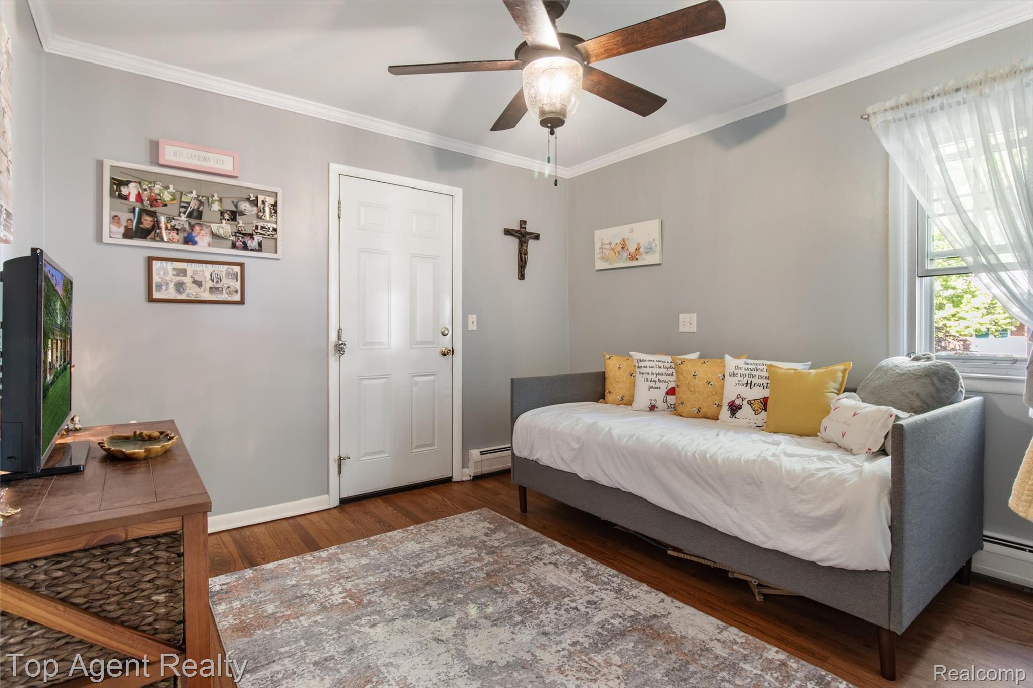 32341 Woody Road Fraser, MI 48026 - Photo 15 of 47 Interior room featuring wood-finish flooring, a ceiling fan with integrated lighting, and a window with natural light