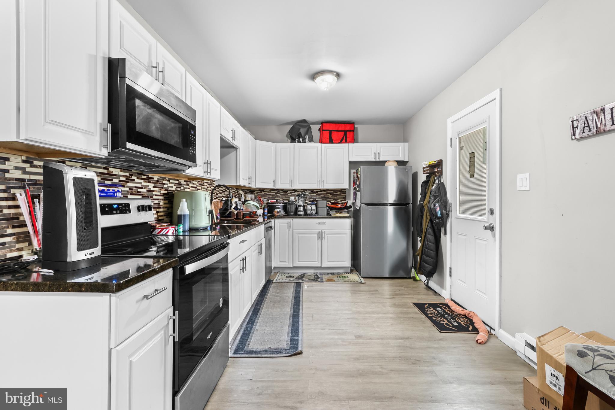 12 South Front Street Coplay, PA 18037 - Photo 11 of 42 a kitchen with stainless steel appliances a stove refrigerator and microwave