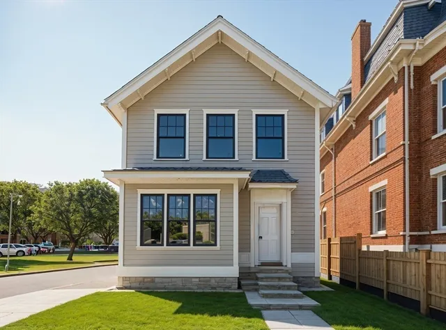 a view of a house with a yard