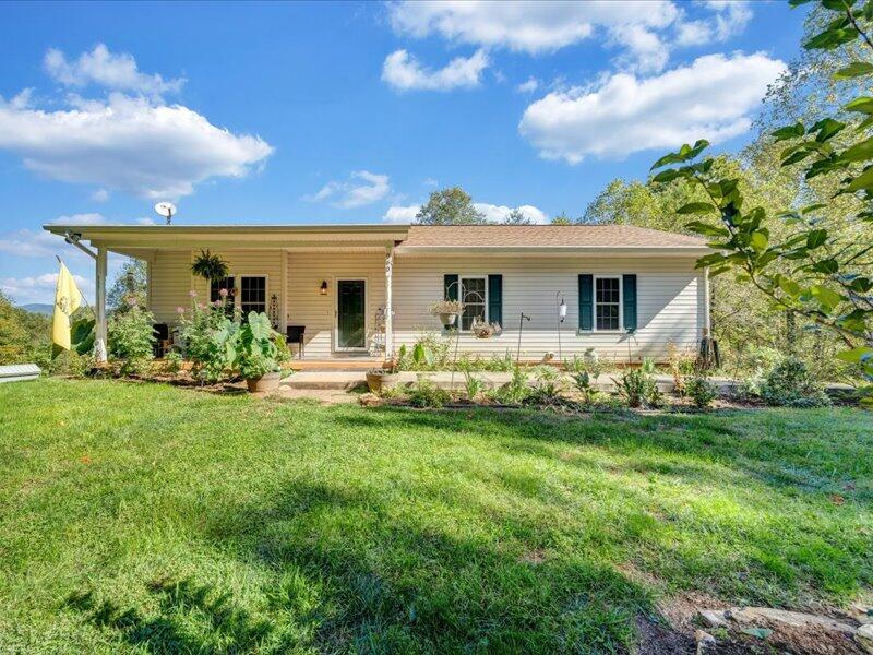 860 Holland Road Callaway, VA 24067 - Photo 1 of 30 a front view of house with yard and green space