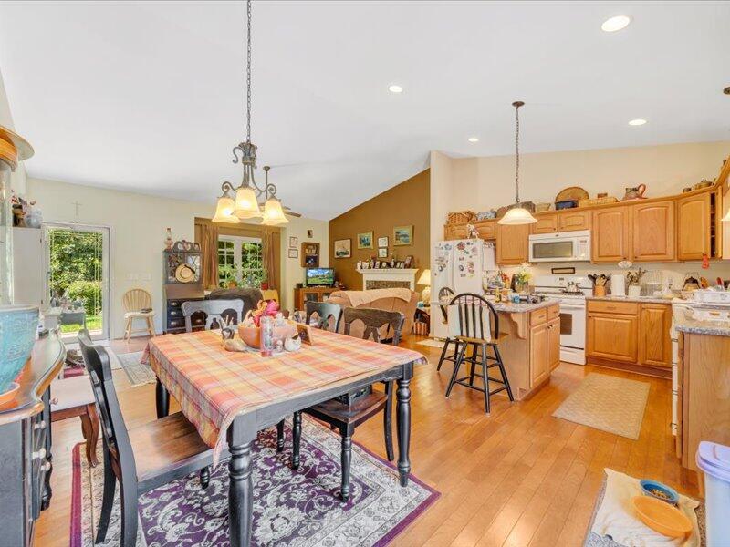 860 Holland Road Callaway, VA 24067 - Photo 17 of 30 a view of a dining room with furniture and wooden floor