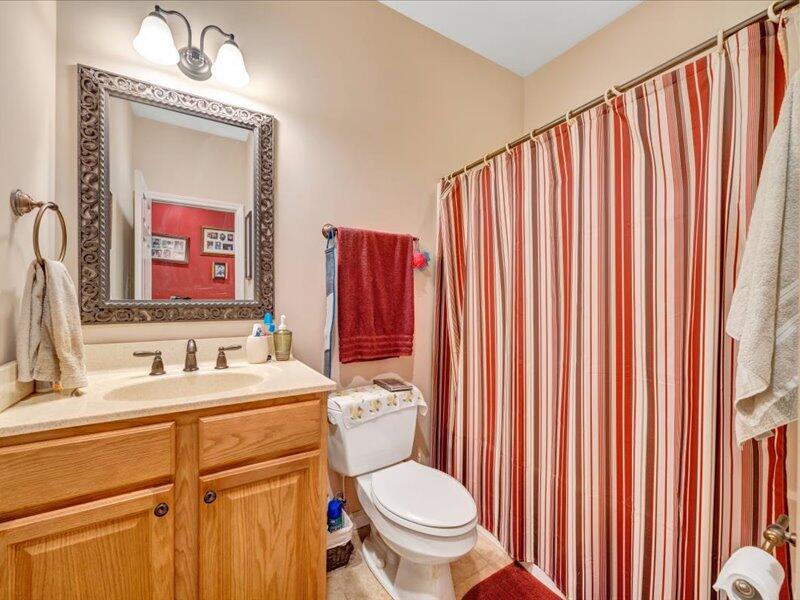 860 Holland Road Callaway, VA 24067 - Photo 18 of 30 a bathroom with a toilet a sink and a mirror