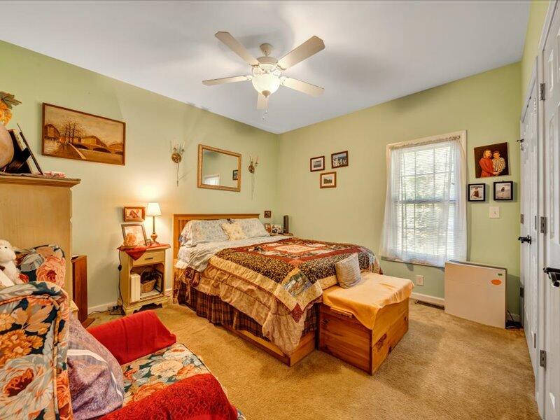 860 Holland Road Callaway, VA 24067 - Photo 20 of 30 a bedroom with a bed and ceiling fan