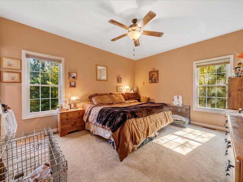 860 Holland Road Callaway, VA 24067 - Photo 21 of 30 a bedroom with a large bed and a window