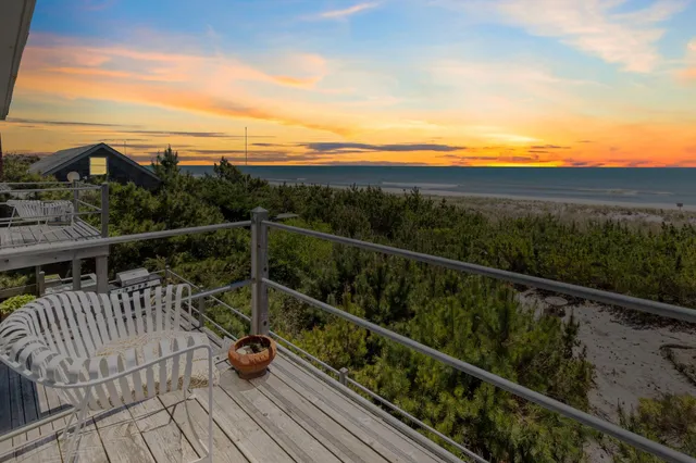 a view of balcony with furniture