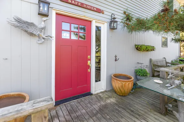 a view of an entryway with wooden floor