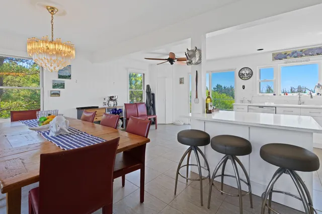 a view of a dining room with furniture and window
