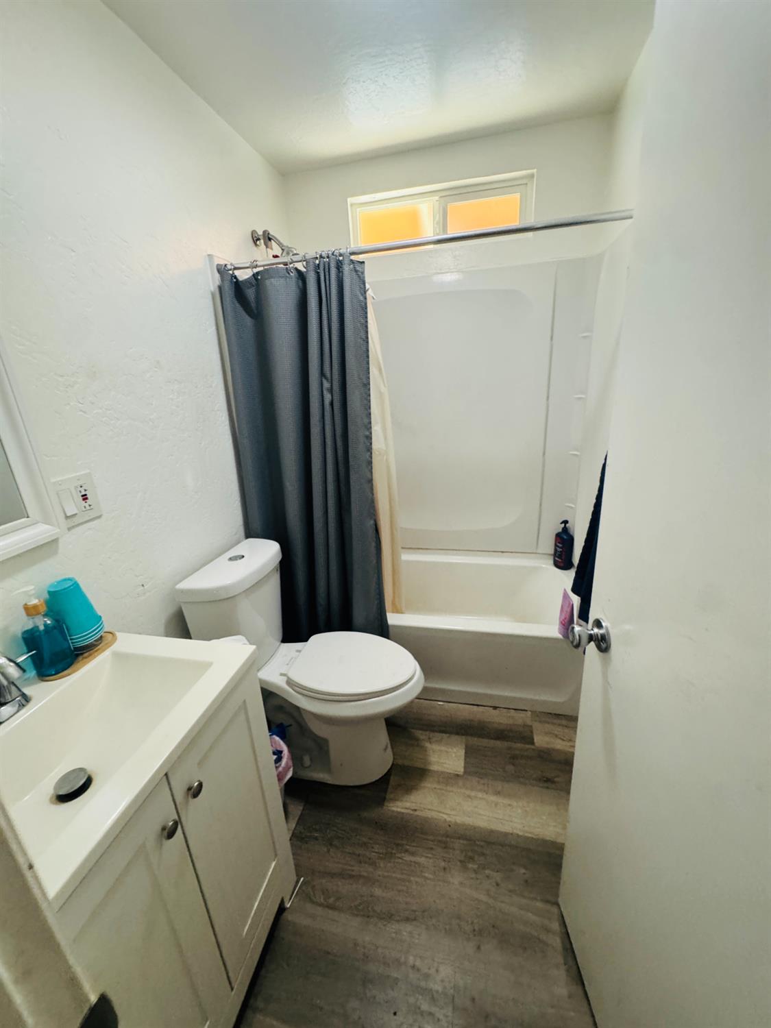 1335 Olive Avenue Sanger, CA 93657 - Photo 13 of 28 a bathroom with a toilet and a shower