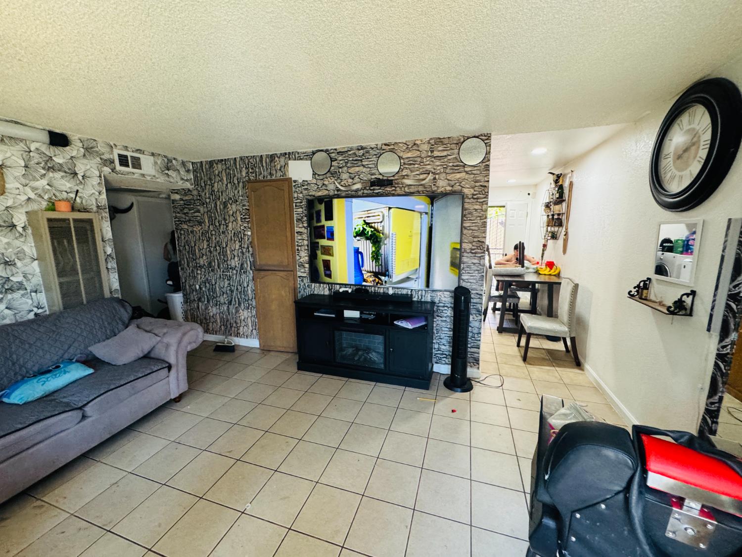 1335 Olive Avenue Sanger, CA 93657 - Photo 14 of 28 a living room with couches and a flat screen tv