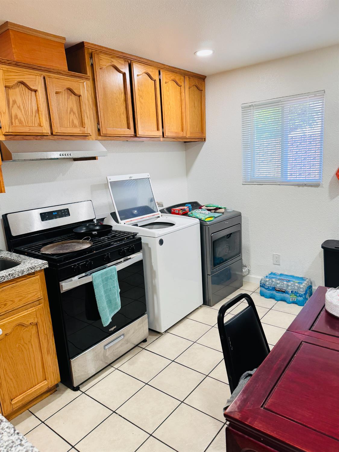 1335 Olive Avenue Sanger, CA 93657 - Photo 20 of 28 a kitchen with stainless steel appliances a stove a sink and a microwave