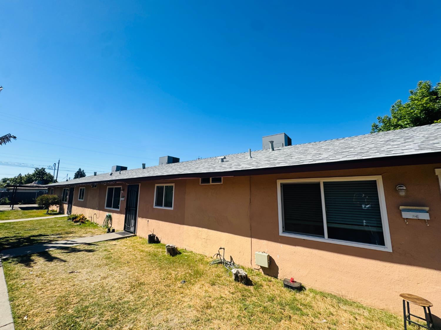 1335 Olive Avenue Sanger, CA 93657 - Photo 2 of 28 a view of a house with swimming pool