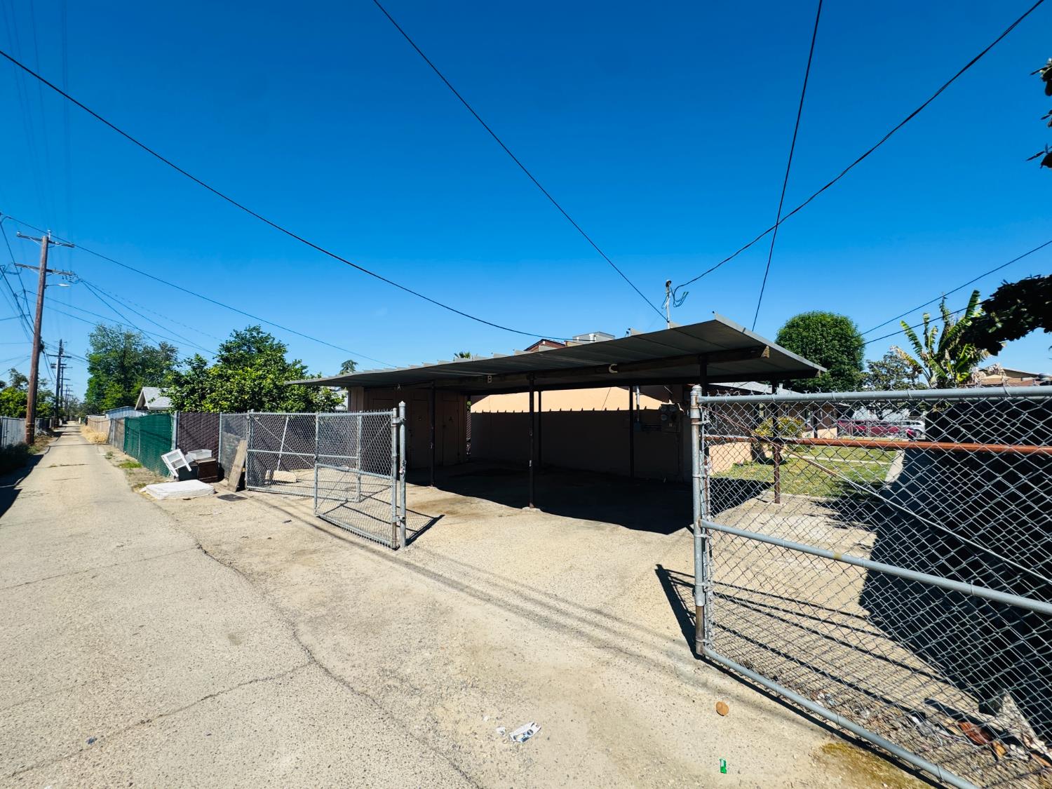 1335 Olive Avenue Sanger, CA 93657 - Photo 27 of 28 a view of a patio with a table and chairs under an umbrella