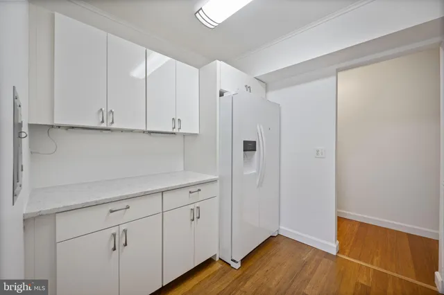 a view of cabinets with wooden floor
