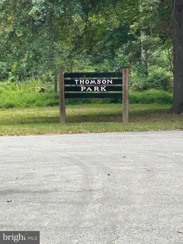 a view of a park with welcome board