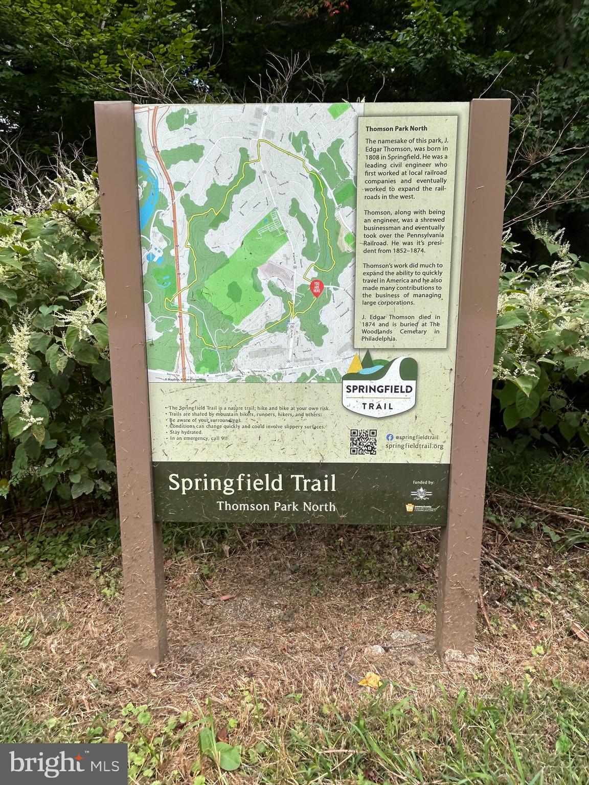 512 Stidman Drive, Unit D4 Springfield, PA 19064 - Photo 15 of 16 a view of outdoor space with a garden and signage