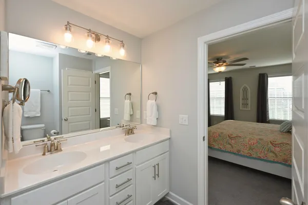 a bedroom with a bed and a couch