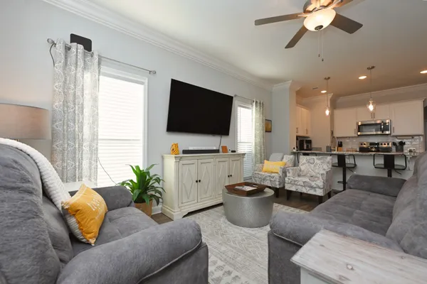 a living room with furniture and a flat screen tv