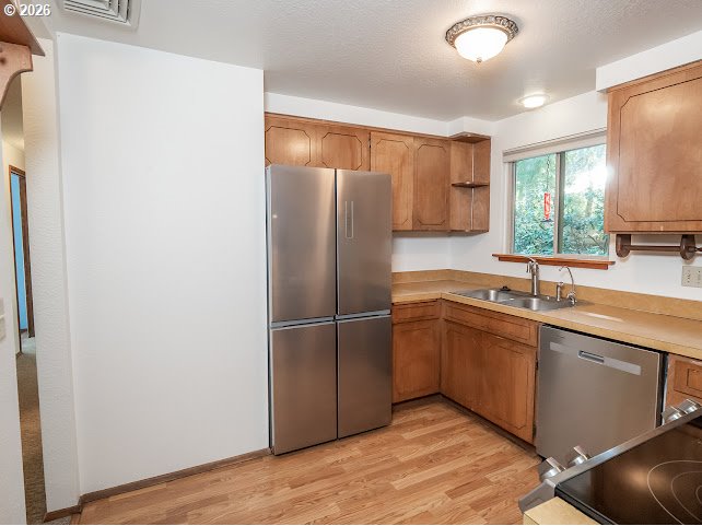 87974 8th Street Veneta, OR 97487 - Photo 24 of 48 a kitchen with stainless steel appliances granite countertop a refrigerator and a sink