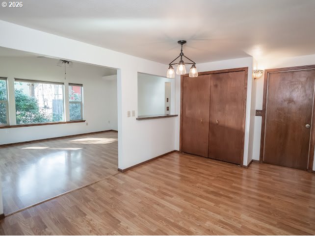 87974 8th Street Veneta, OR 97487 - Photo 27 of 48 a view of an empty room with wooden floor and a window