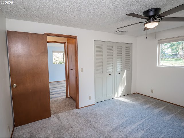 87974 8th Street Veneta, OR 97487 - Photo 32 of 48 an empty room with closet and a chandelier fan