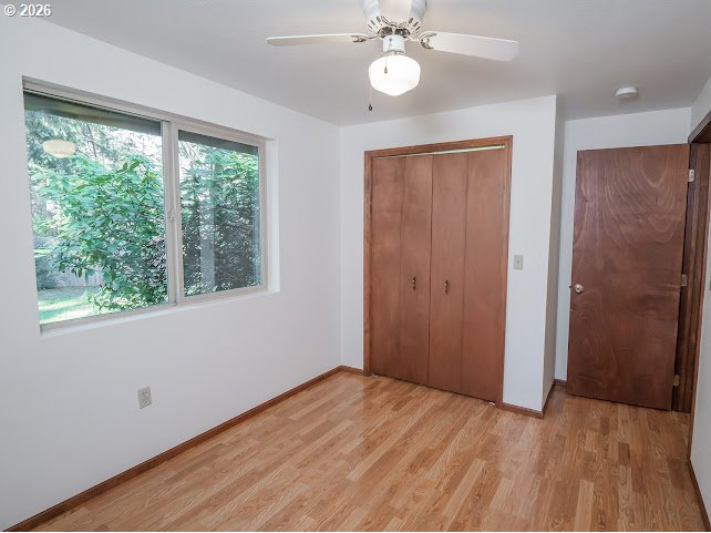 87974 8th Street Veneta, OR 97487 - Photo 41 of 48 wooden floor in an empty room with a window