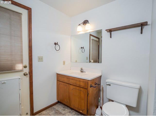 87974 8th Street Veneta, OR 97487 - Photo 43 of 48 a bathroom with a toilet a sink and mirror