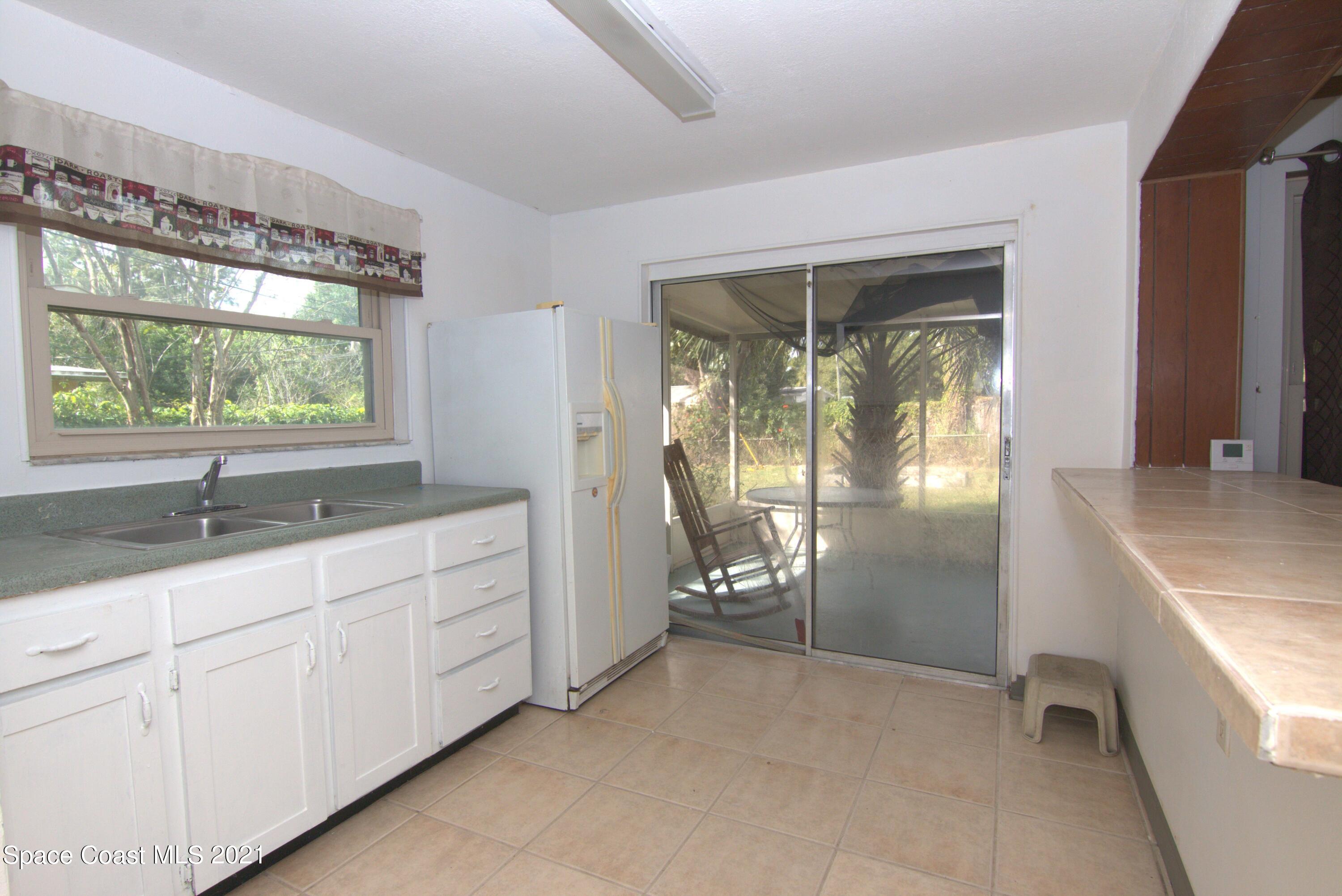 1201 Montclair Road Cocoa, FL 32922 - Photo 4 of 20 kitchen to patio