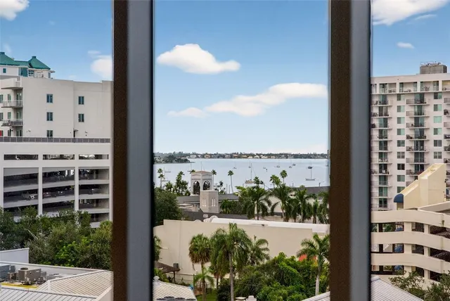a kitchen with a refrigerator and trees