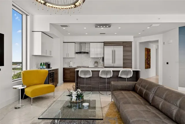 a kitchen with stainless steel appliances granite countertop a sink and a stove