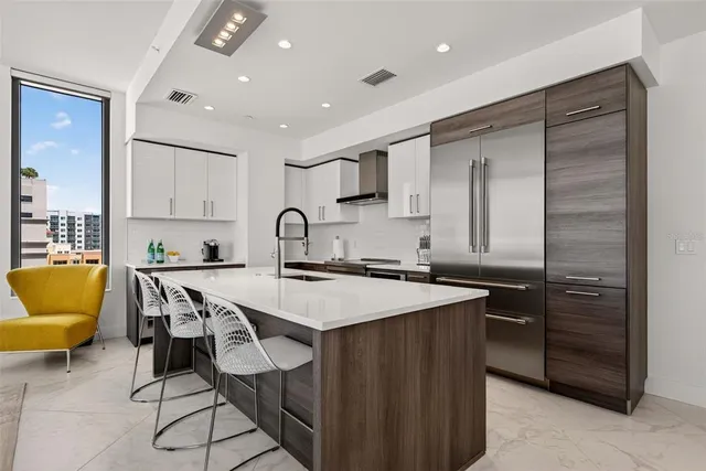 a view of swimming pool with outdoor seating and plants