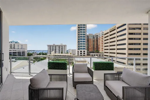 a spacious bedroom with a bed and couch