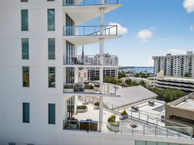 a en suite bathroom with a granite countertop sink and mirror