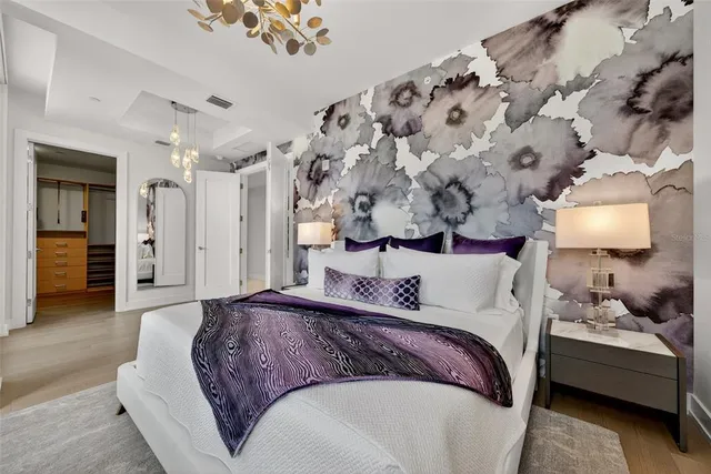 a bed room with a bed and a window