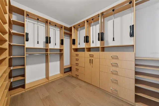 a bedroom with a bed and a television