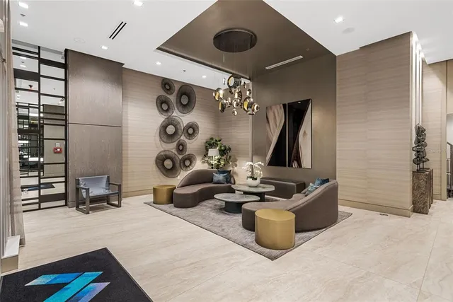 a living room with furniture and a lamp